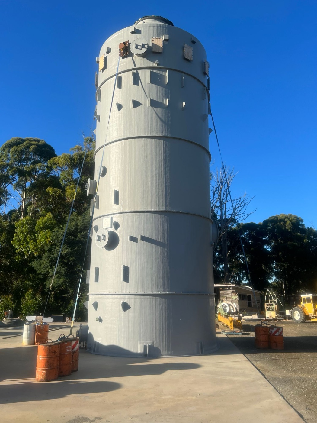 Tall grey FRP tower fabricated in the RGE yard